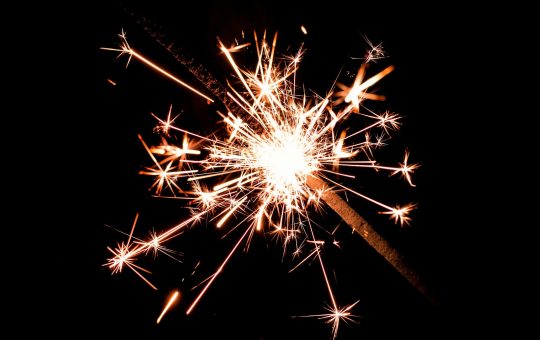 Photo of a sparkler as a report from the Tony Blair Institute calling on the UK government to lead in navigating the complex intersection of arts and AI by adapting copyright laws spark backlash, concerns, and criticism about the impact of generative artificial intelligence models on artists, writers, and other human creativity industries.
